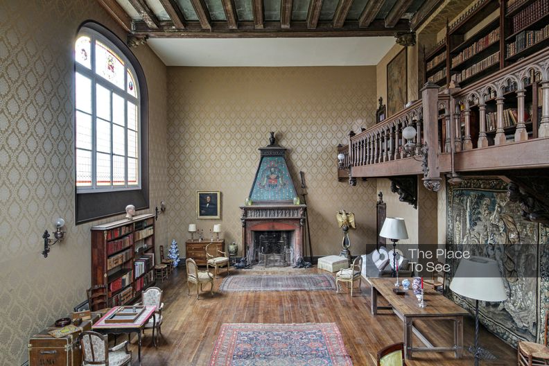 Faded mansion with wall hangings and woodwork