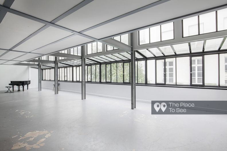 Industrial reception room with glass roof