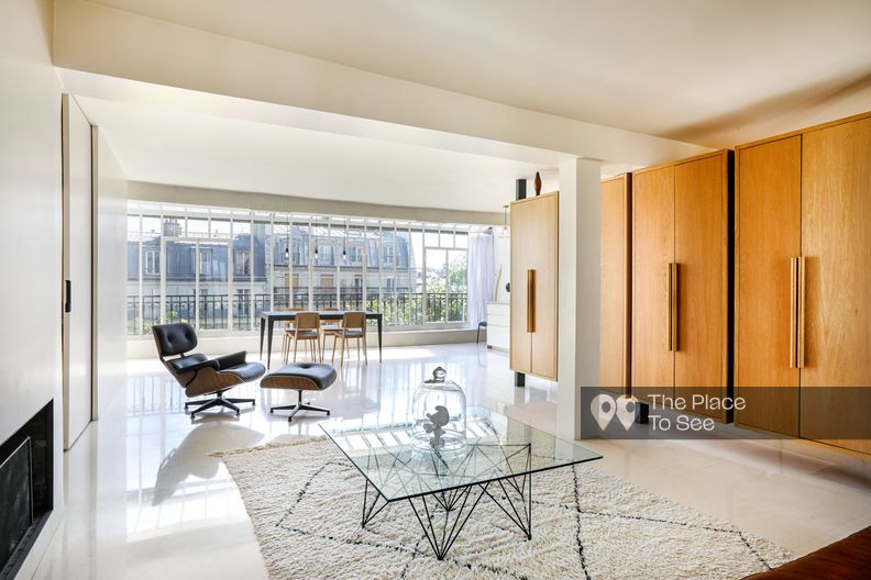 Clean duplex with beautiful glass wall and a Parisian view