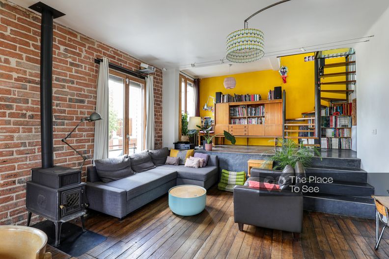 Colorful bohemian style loft with brick wall