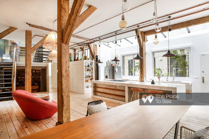 Cosy loft with wood beams and marble kitchen