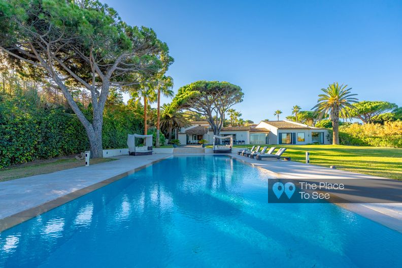 Villa with garden, pool, palm trees and beach near by