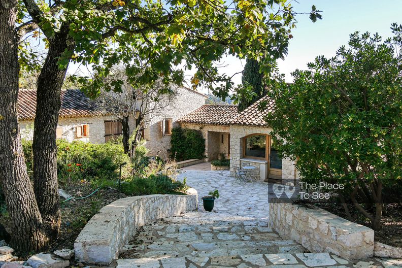 Stone house with pool and the sea in the distance