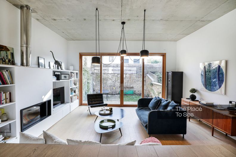 Architectural brick house with raw concrete ceiling