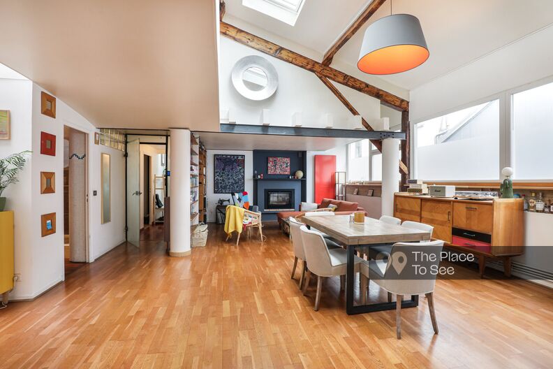 Colorful loft with exposed beams