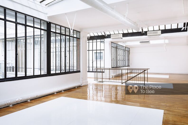 Old bright printing house with wooden floors and glass roof