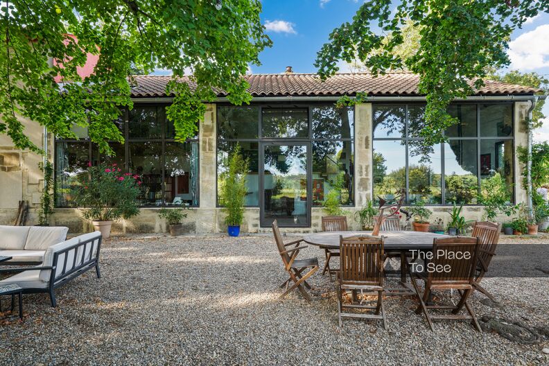 house in a green setting in a bohemian chic style