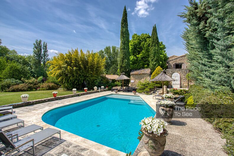 Stone farmhouse with lush garden