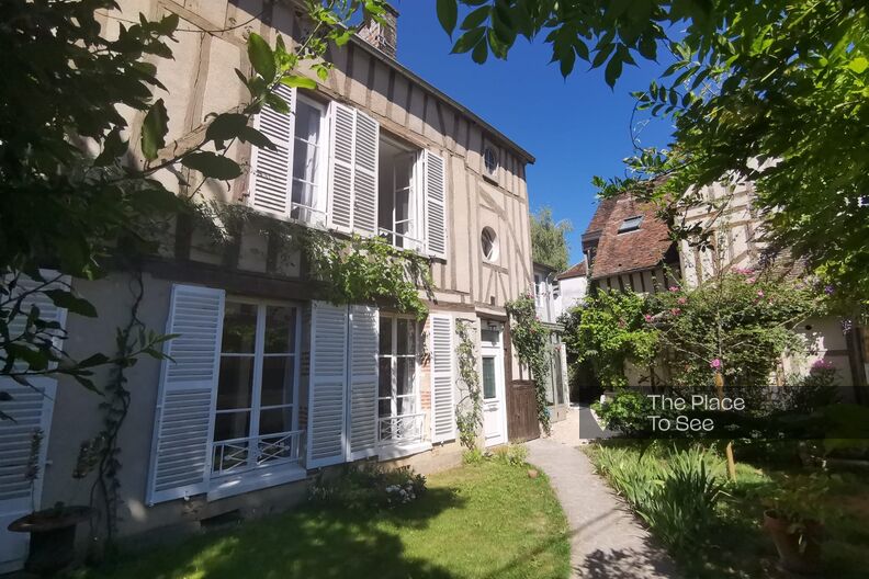 Half-timbered house and its flower garden