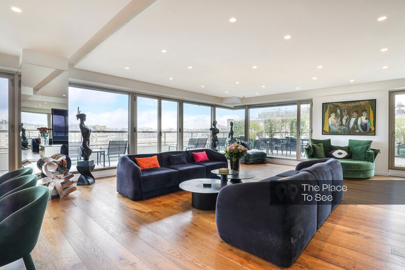 Penthouse with large bay windows and surrounding terrace